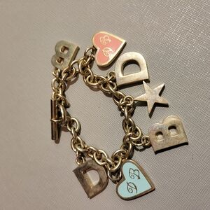 Dooney & Bourke Gold Charm Bracelet with Heart Accents